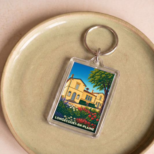 Porte-clés souvenir de la ville de Longecourt-en-Plaine avec une illustration stylisée.