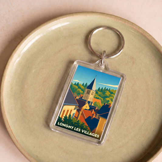 Porte-clés souvenir de la ville de Longny les Villages avec une illustration stylisée.