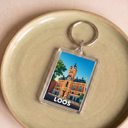 Porte-clés souvenir de la ville de Loos avec une illustration stylisée.