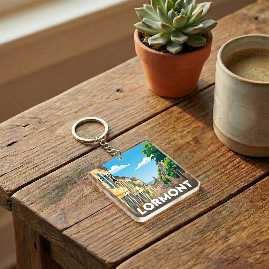 Porte-clés souvenir de la ville de Lormont avec une illustration stylisée d'un paysage urbain.