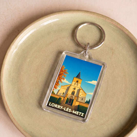 Porte-clés souvenir de la ville de Lorry-lès-Metz avec une illustration stylisée de son église.