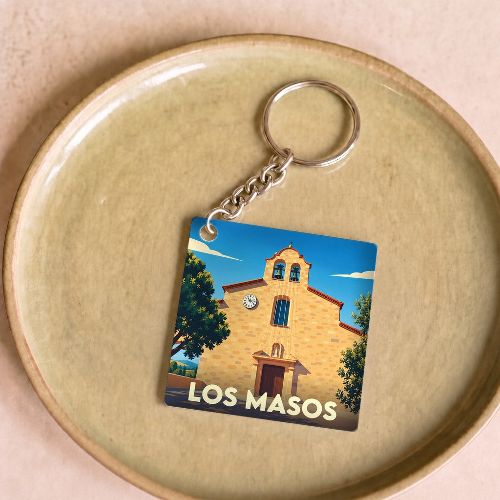 Porte-clés souvenir de la ville de Los Masos avec une illustration stylisée de son église.