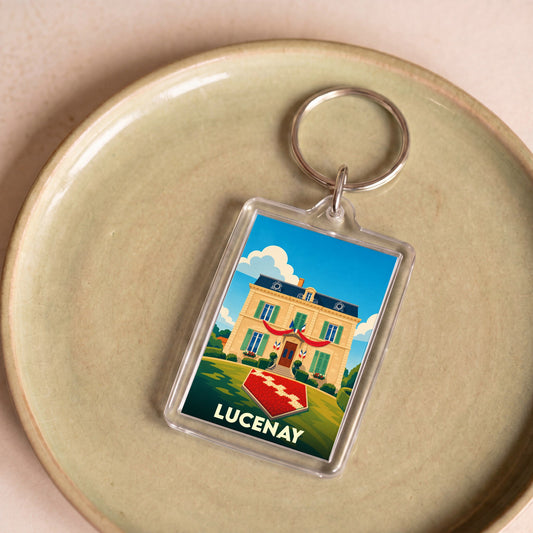 Porte-clés souvenir de la ville de Lucenay avec une illustration stylisée de sa mairie.