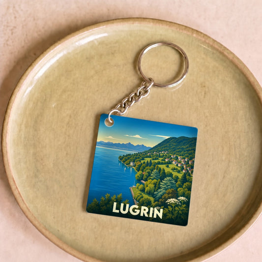 Porte-clés souvenir de la ville de Lugrin avec une illustration stylisée de ses paysages.
