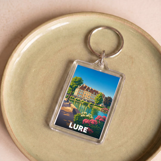 Porte-clés souvenir de la ville de Lure avec une illustration stylisée.