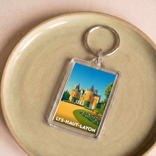 Porte-clés souvenir de la ville de Lys-Haut-Layon avec une illustration stylisée de son château.