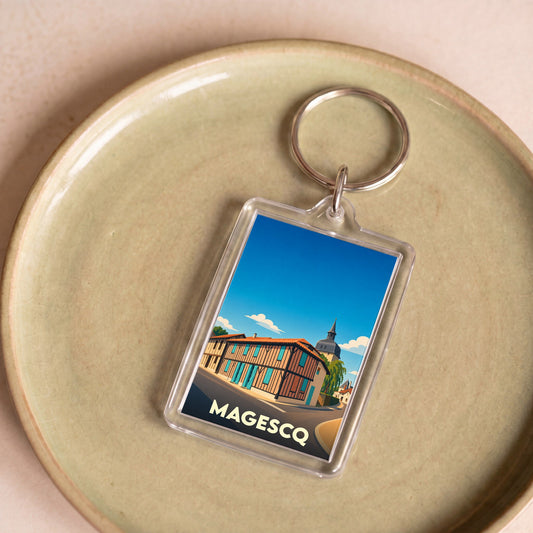 Porte-clés souvenir de la ville de Magescq avec une illustration stylisée.
