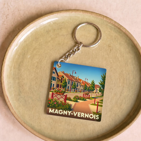 Porte-clés souvenir de la ville de Magny-Vernois avec une illustration stylisée.