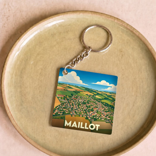 Porte-clés souvenir de la ville de Maillot avec une illustration stylisée vue du ciel.