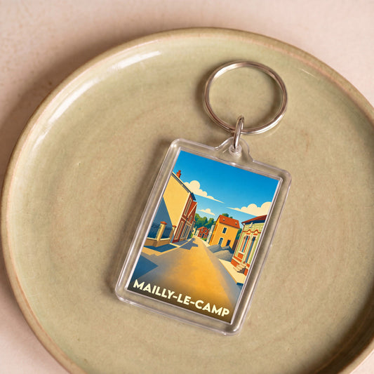 Porte-clés souvenir de la ville de Mailly-le-Camp avec une illustration stylisée.
