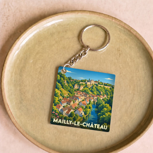 Porte-clés souvenir de la ville de Mailly-le-Château avec une illustration colorée et stylisée du village.