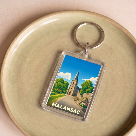 Porte-clés souvenir de la ville de Malansac avec une illustration stylisée de son église.