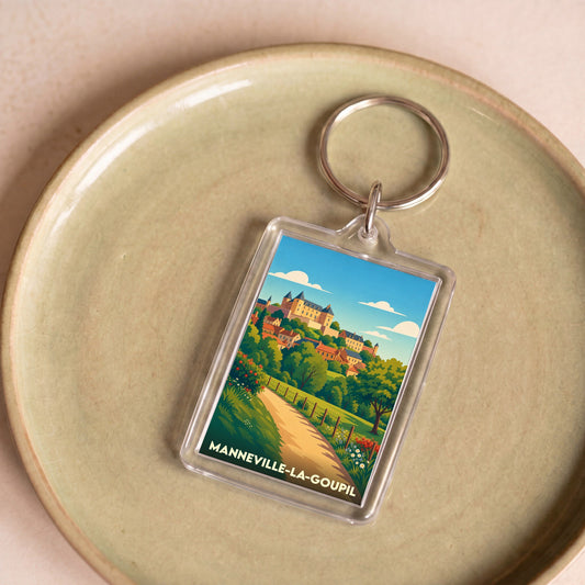 Porte-clés souvenir de la ville de Manneville-la-Goupil avec une illustration stylisée.