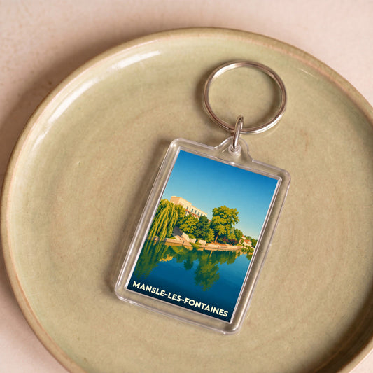 Porte-clés souvenir de la ville de Mansle-les-Fontaines avec une illustration stylisée des bords de Charente.