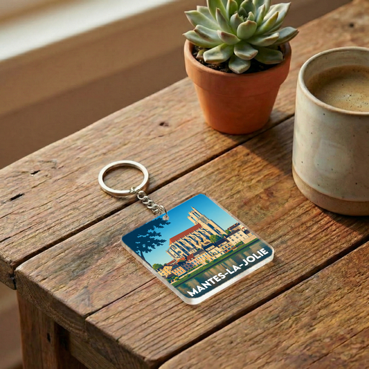 Porte-clés souvenir de la ville de Mantes-la-Jolie avec une illustration stylisée.