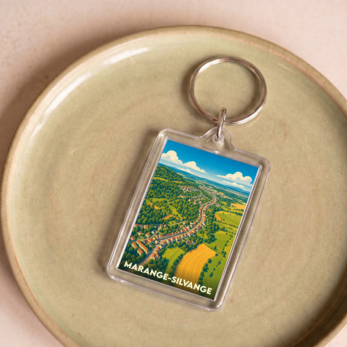Porte-clés souvenir de la ville de Marange-Silvange avec une illustration stylisée.