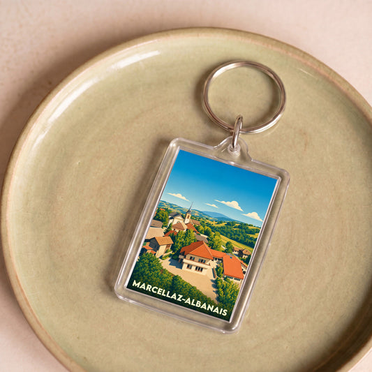 Porte-clés souvenir de la ville de Marcellaz-Albanais avec une illustration stylisée.