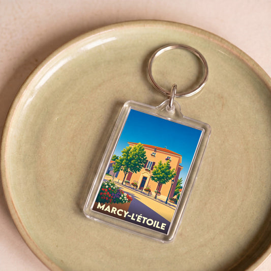 Porte-clés souvenir de la ville de Marcy-l'Étoile avec une illustration stylisée.