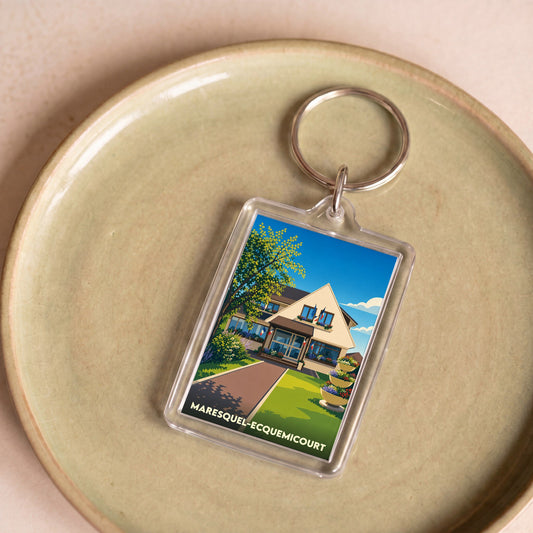 Porte-clés souvenir de la ville de Maresquel-Ecquemicourt avec une illustration stylisée de sa mairie.