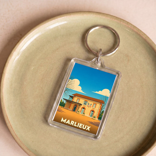 Porte-clés souvenir de la ville de Marlieux avec une illustration stylisée.