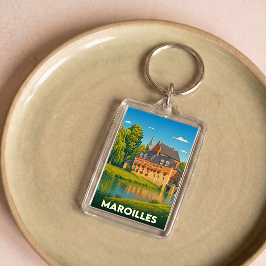 Porte-clés souvenir de la ville de Maroilles avec une illustration stylisée.