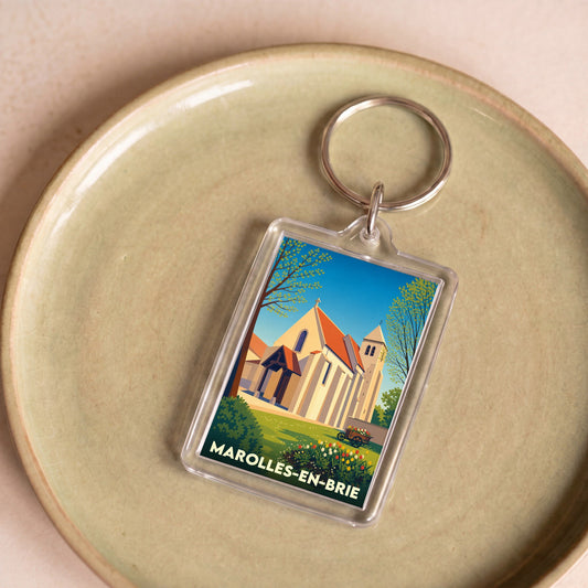 Porte-clés souvenir de la ville de Marolles-en-Brie avec une illustration stylisée de son église.