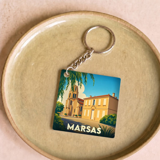 Porte-clés souvenir de la ville de Marsas avec une illustration stylisée.