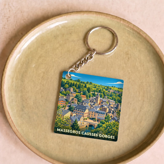 Porte-clés souvenir de la commune de Massegros Causses Gorges avec une illustration stylisée du village.