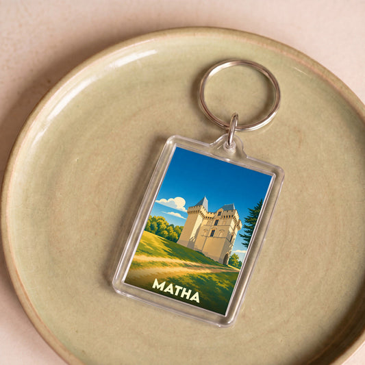Porte-clés souvenir de la ville de Matha avec une illustration stylisée de son château.