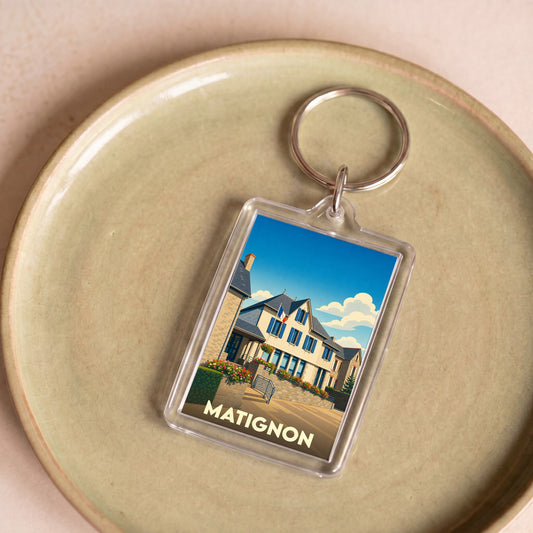 Porte-clés souvenir de la ville de Matignon avec une illustration stylisée.