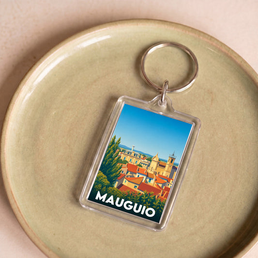 Porte-clés souvenir de la ville de Mauguio avec une illustration stylisée.