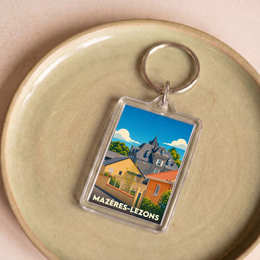 Porte-clés souvenir de la ville de Mazères-Lezons avec une illustration stylisée.
