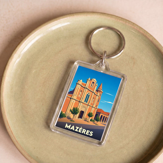Porte-clés souvenir de la ville de Mazères avec une illustration stylisée de son église.