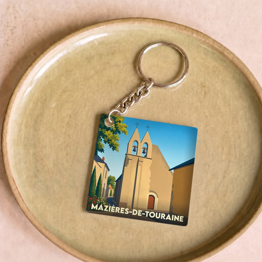Porte-clés souvenir de la ville de Mazières-de-Touraine avec une illustration stylisée de son église.