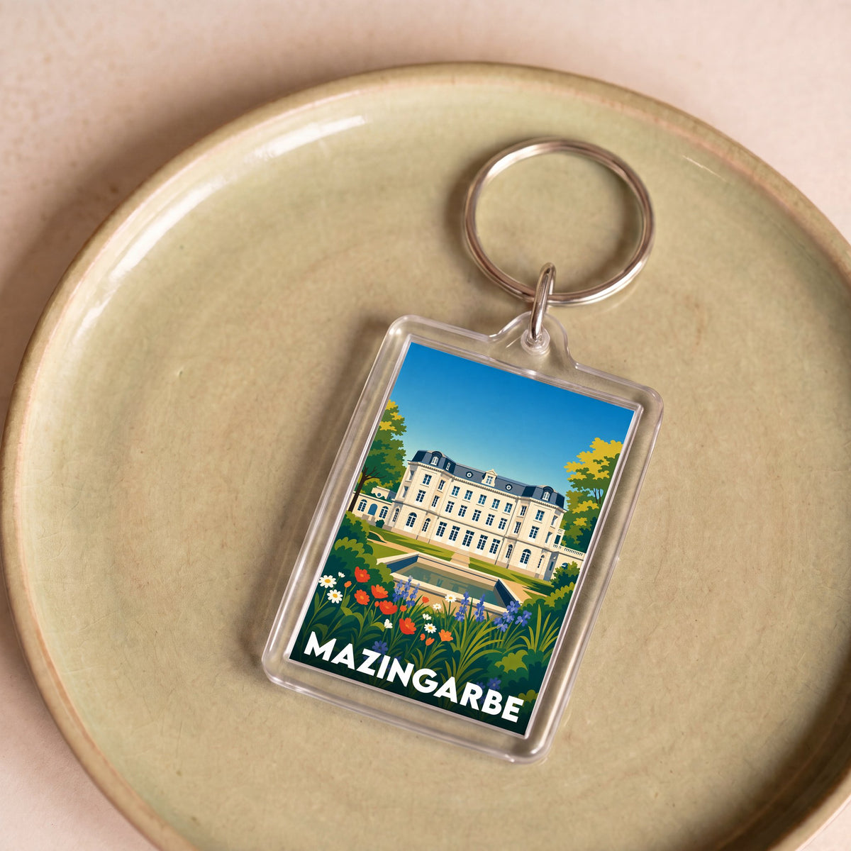 Porte-clés souvenir de la ville de Mazingarbe avec une illustration stylisée de son château.