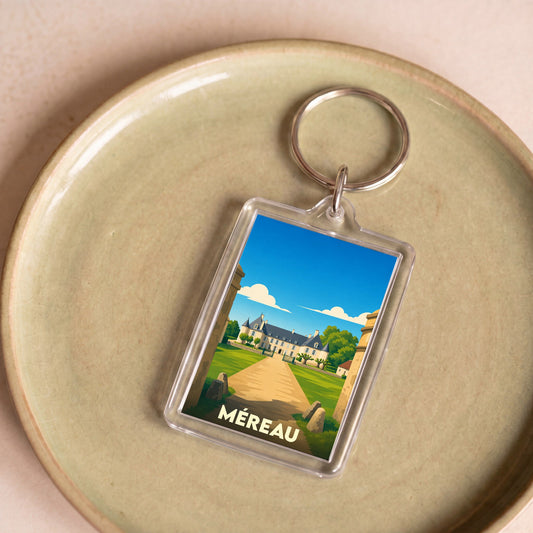 Porte-clés souvenir de la ville de Méreau avec une illustration stylisée d'un château.