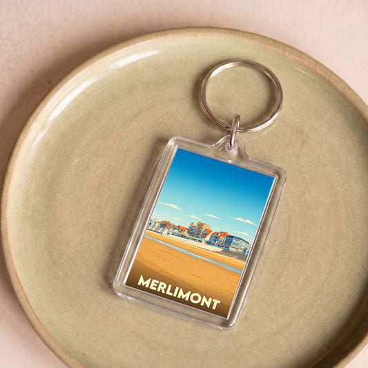 Porte-clés souvenir de la ville de Merlimont avec une illustration stylisée de son front de mer.