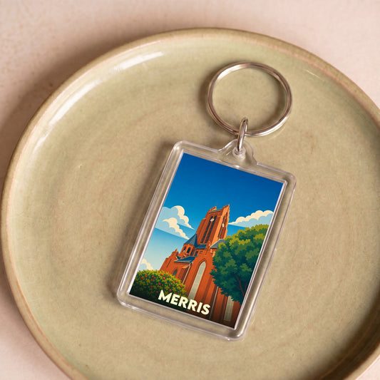 Porte-clés souvenir de la ville de Merris avec une illustration stylisée de son église.