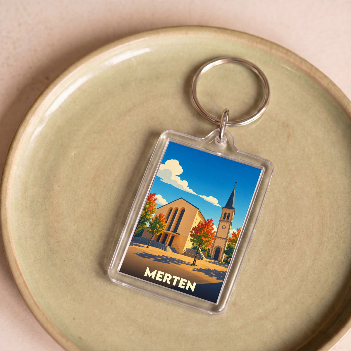 Porte-clés souvenir de la ville de Merten avec une illustration stylisée.
