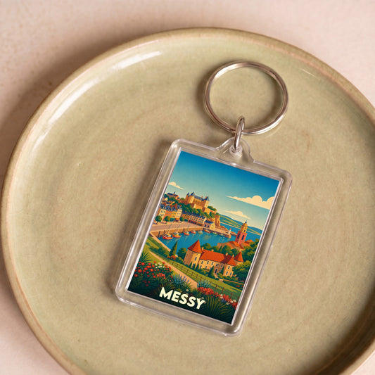 Porte-clés souvenir de la ville de Messy avec une illustration stylisée de son paysage.