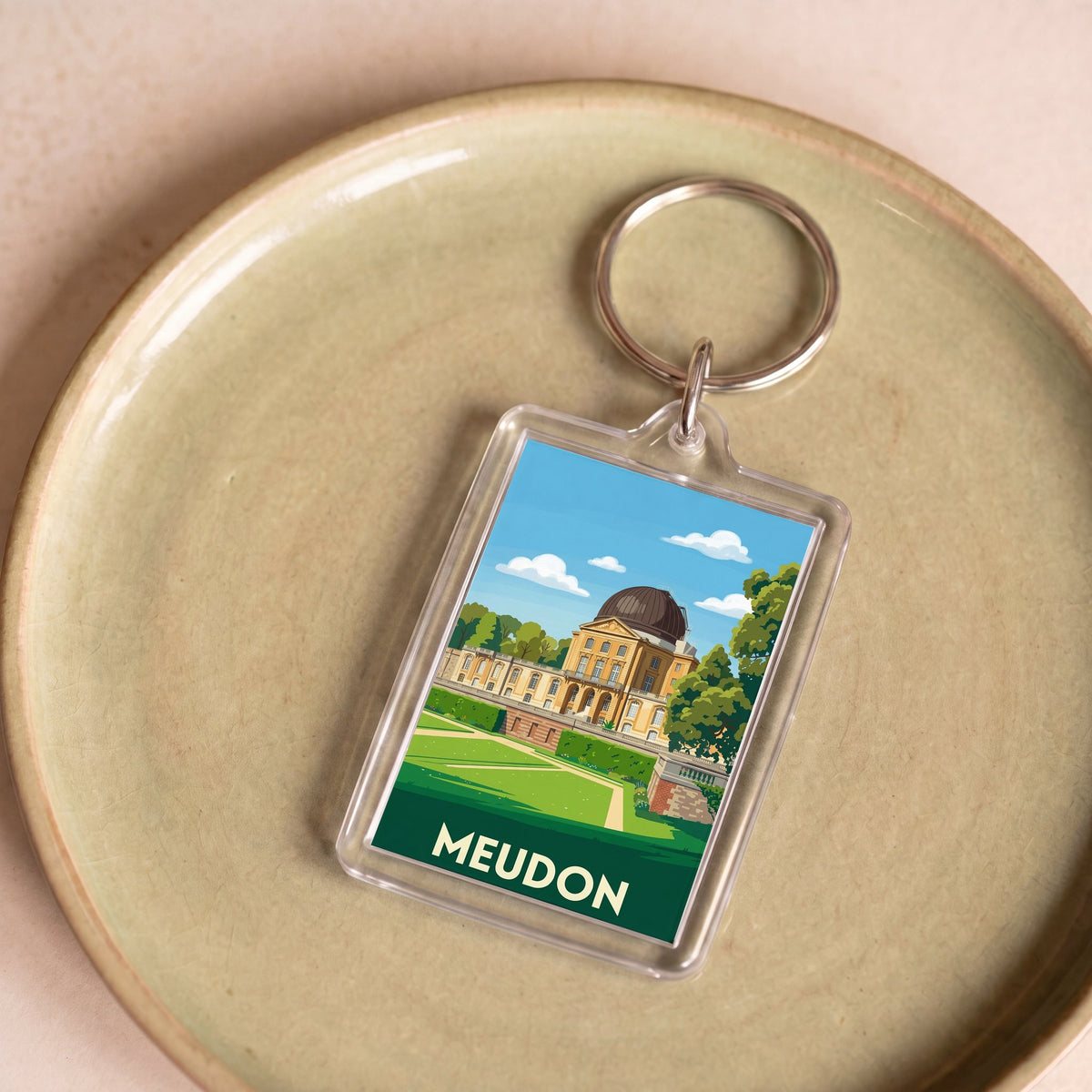 Porte-clés souvenir de la ville de Meudon avec une illustration stylisée de l'observatoire.