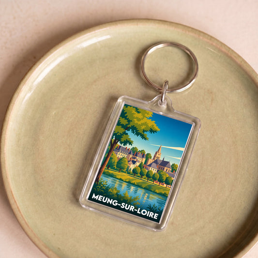 Porte-clés souvenir de la ville de Meung-sur-Loire avec une illustration stylisée.