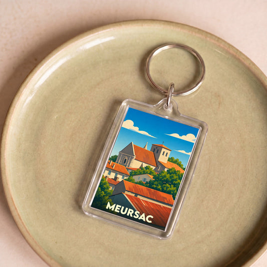 Porte-clés souvenir de la ville de Meursac avec une illustration stylisée.