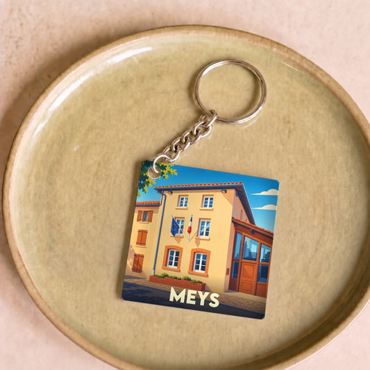 Porte-clés souvenir de la ville de Meys avec une illustration stylisée de sa mairie.