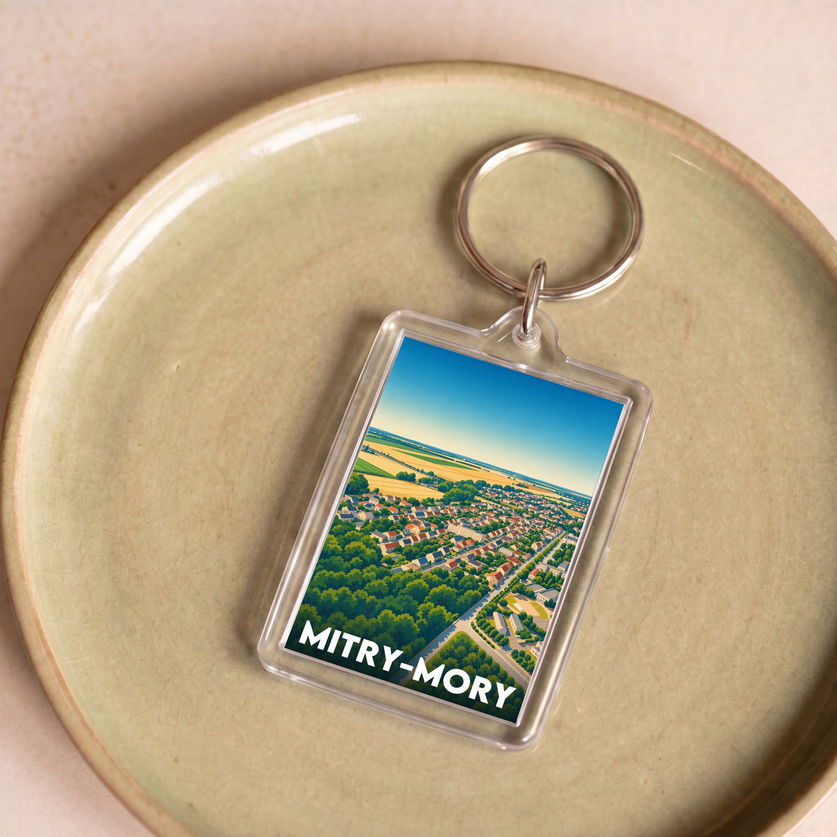 Porte-clés souvenir de la ville de Mitry-Mory avec une illustration stylisée.