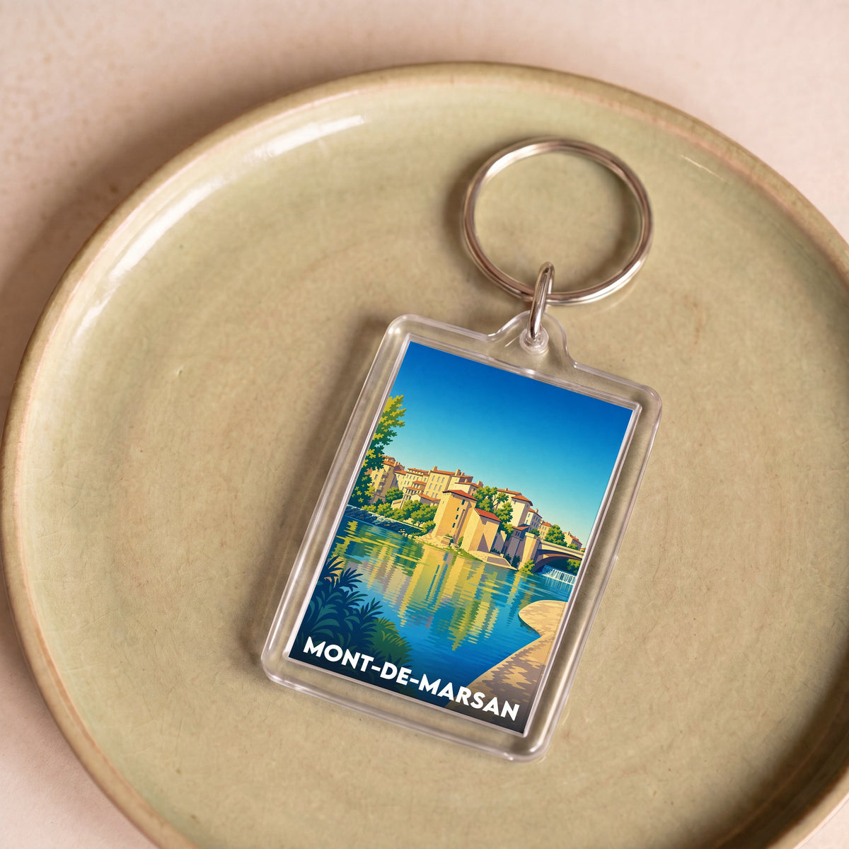 Porte-clés souvenir de la ville de Mont-de-Marsan avec une illustration stylisée.