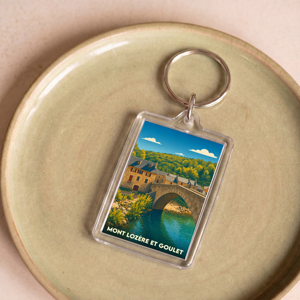 Porte-clés souvenir de Mont Lozère et Goulet avec une illustration stylisée d'un pont en pierre.