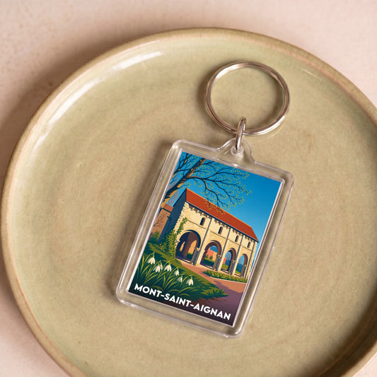 Porte-clés souvenir de la ville de Mont-Saint-Aignan avec une illustration colorée et stylisée.