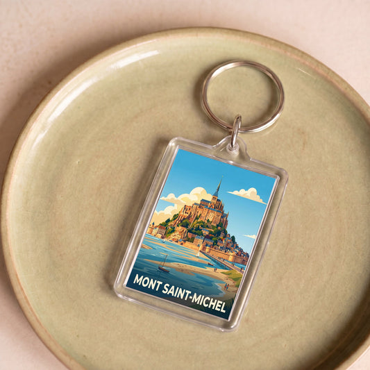 Porte-clés souvenir de la ville du Mont Saint-Michel avec une illustration stylisée.