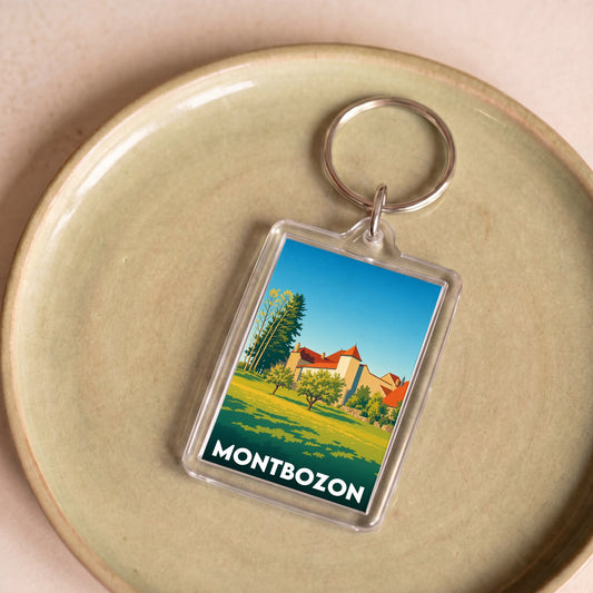 Porte-clés souvenir de la ville de Montbozon avec une illustration stylisée.